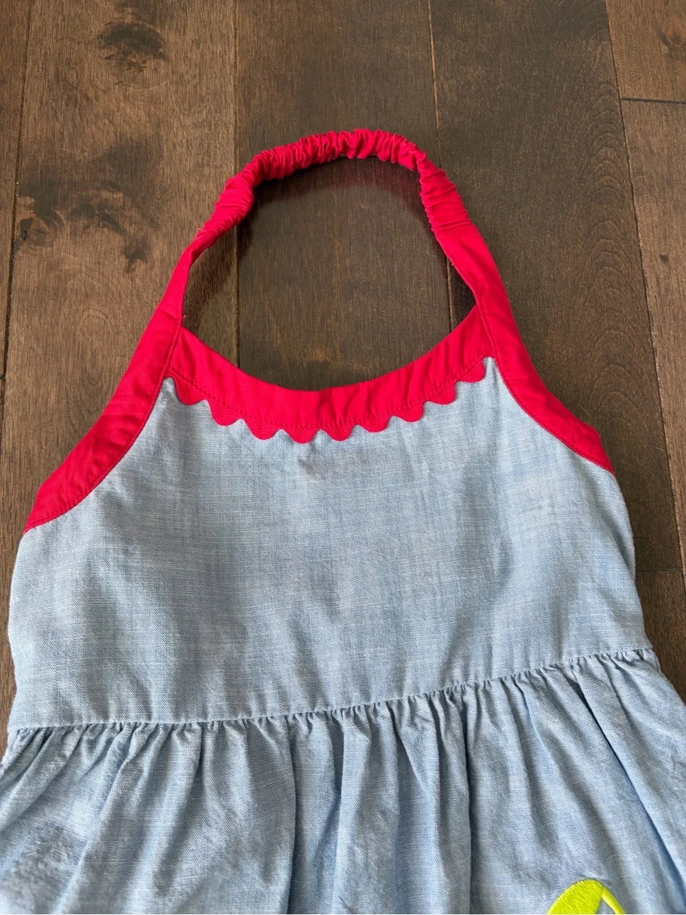 Gymboree Toddler Girl Denim Halter Dress with red trim and cherry pockets .